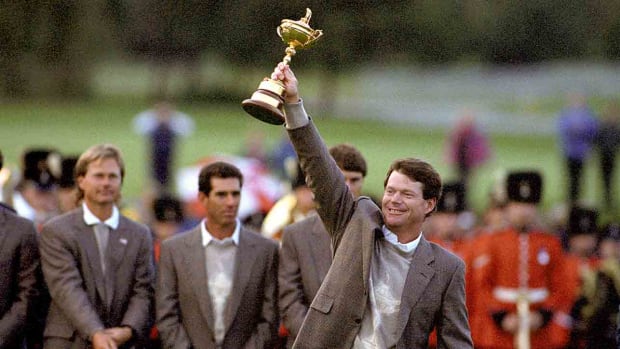 American Ryder Cup captain Tom Watson holds the cup aloft at the Belfry in 1993 after defeating the European team to retain the trophy.